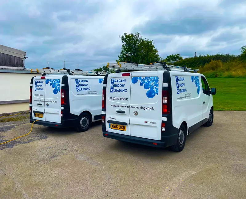 Two Trapani Window Cleaning vans parked side by side